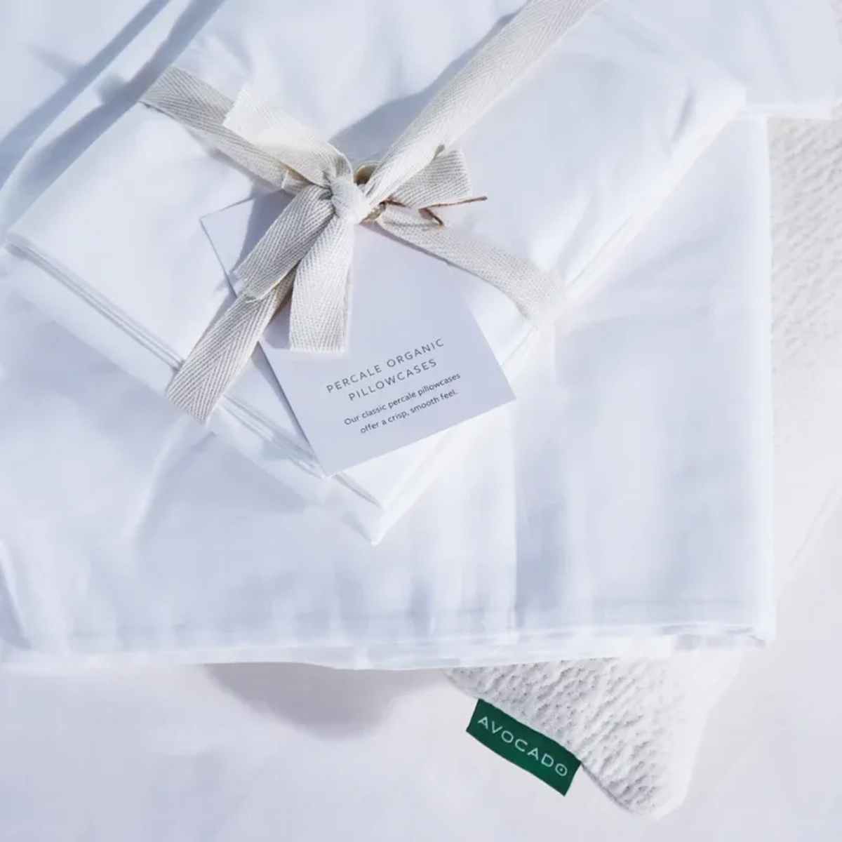 Folded Avocado organic cotton percale pillowcases.