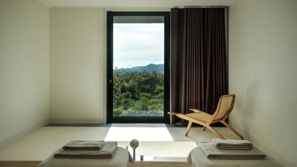 Casa de São Lourenço spa bath with minimalist interior and mountain views through large window