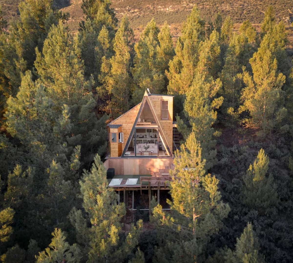 Contemporary eco home at La Bruyere Farm with landscaped garden and mountain backdrop in Cape countryside.