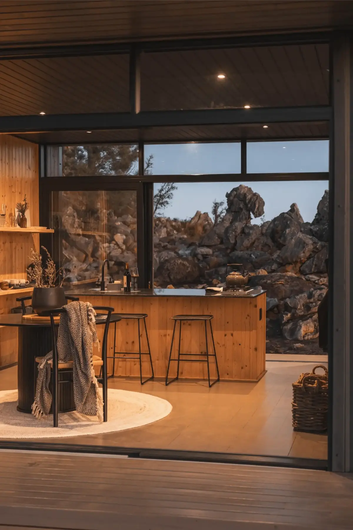 Warm timber-clad kitchen of On The Hill cabin in the Hemel-en-Aarde Valley.