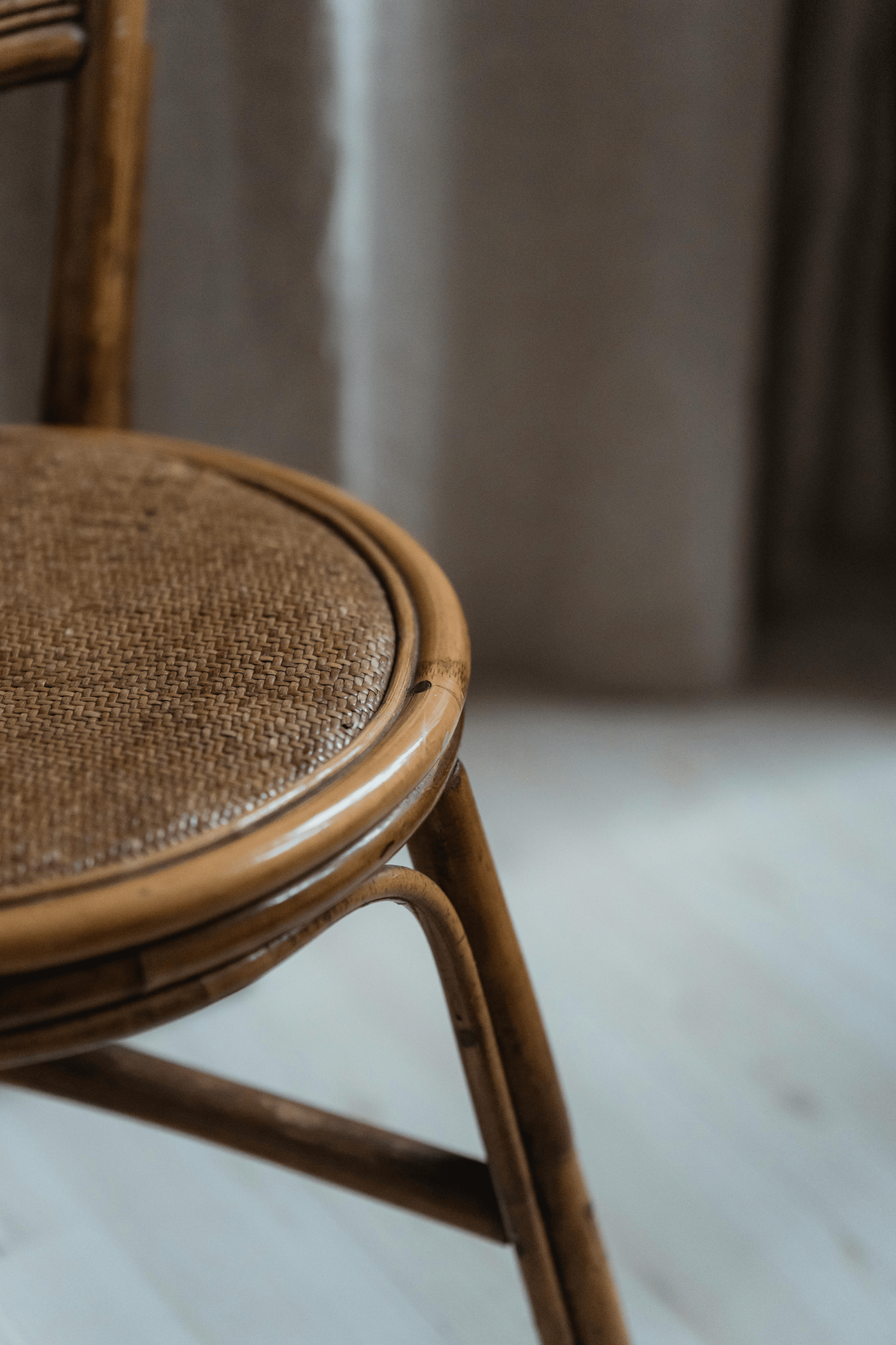Vintage rattan chair seat highlighting natural cane weave texture for boho home decor.