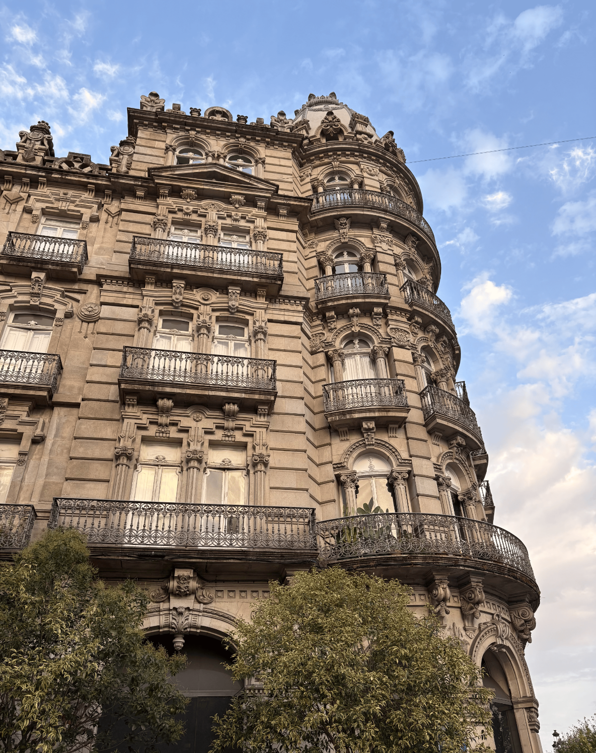 Ornate early-20th-century stone building in Vigo, Spain.