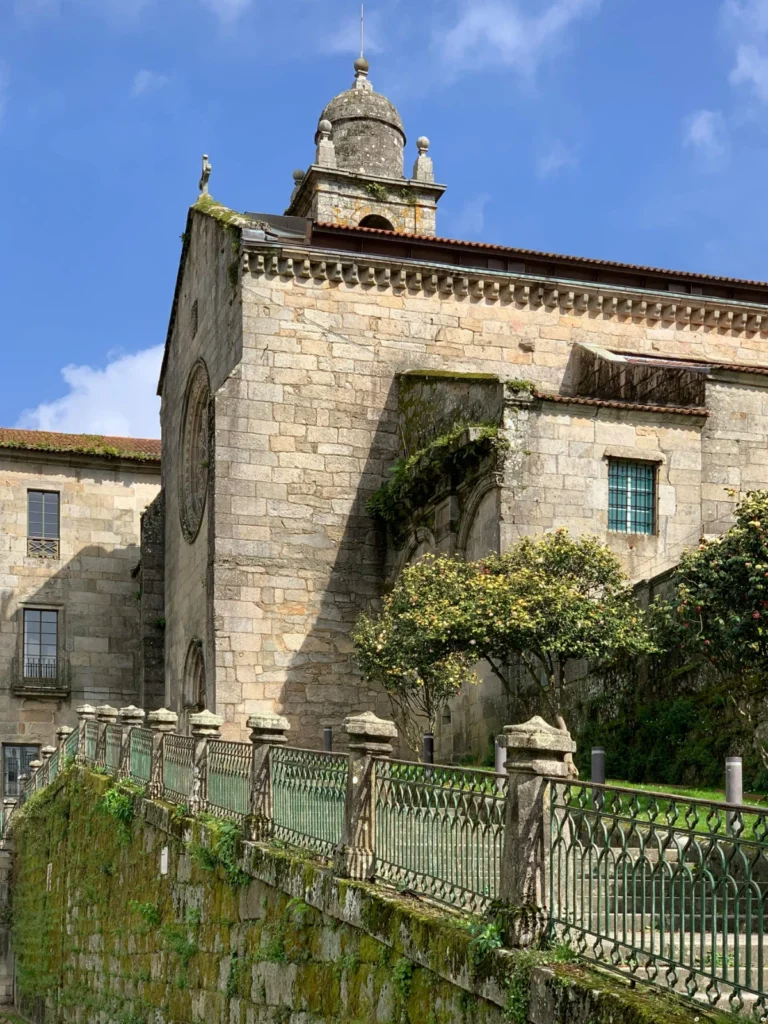 Historic Pontevedra old town with stone buildings, church tower, and elevated walkway