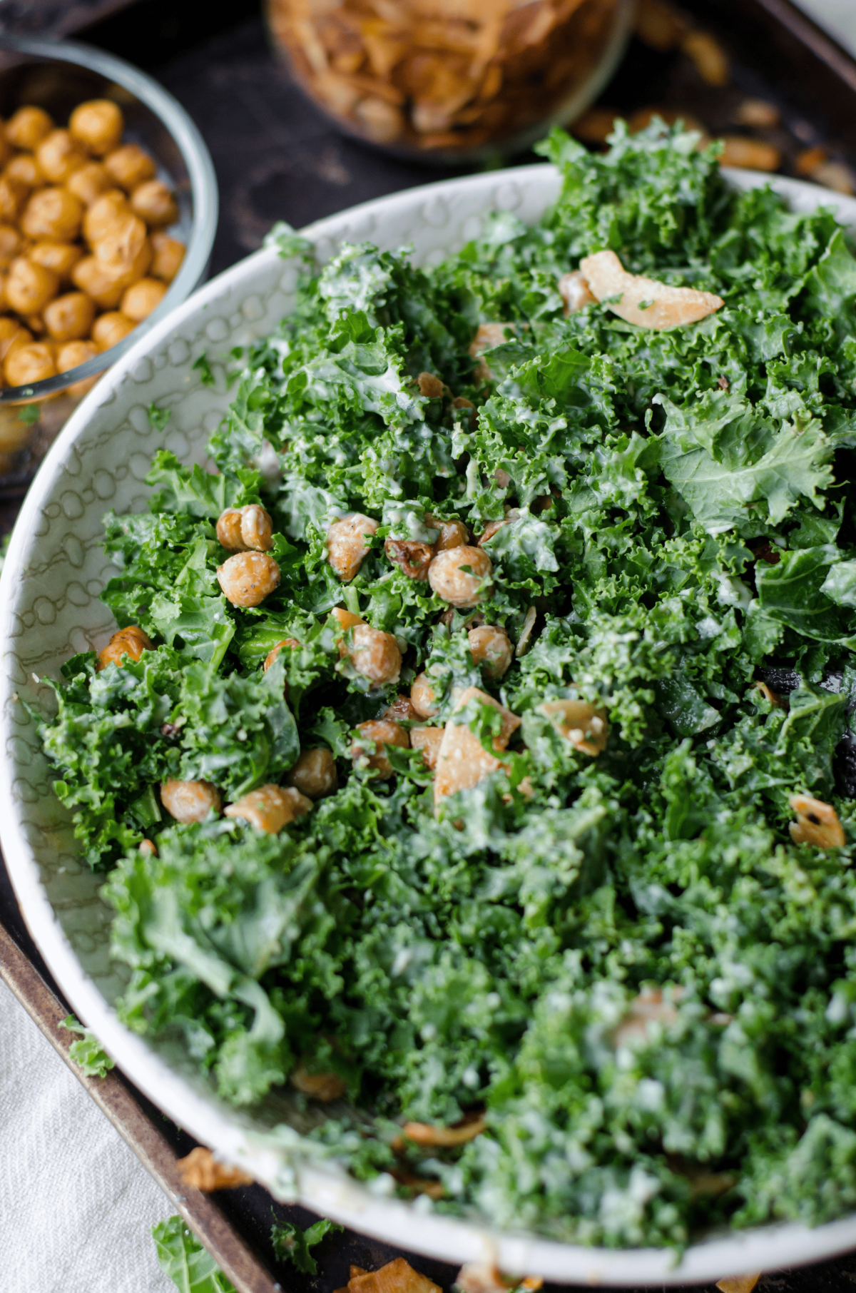 Close-up of creamy kale and roasted chickpea Caesar salad.