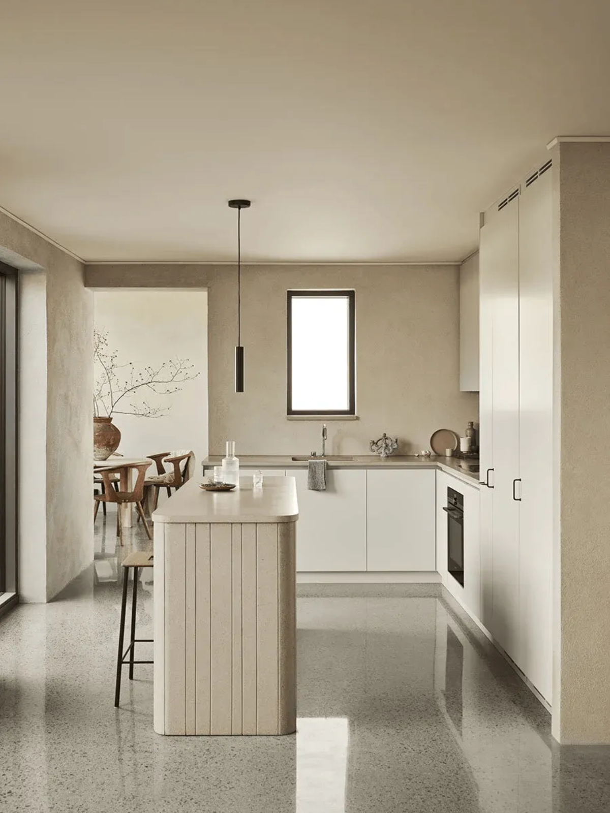 Minimalist neutral‑toned kitchen designed by Daniella Witte.