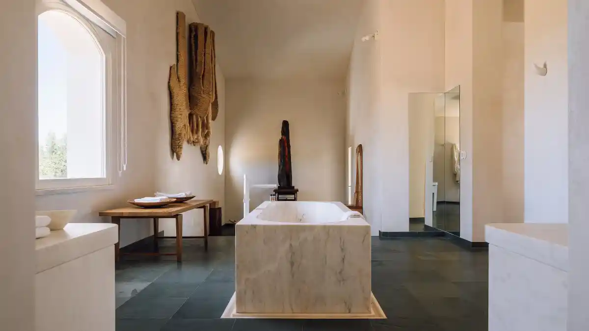 Tranquil Alentejo suite bathroom with freestanding marble tub.