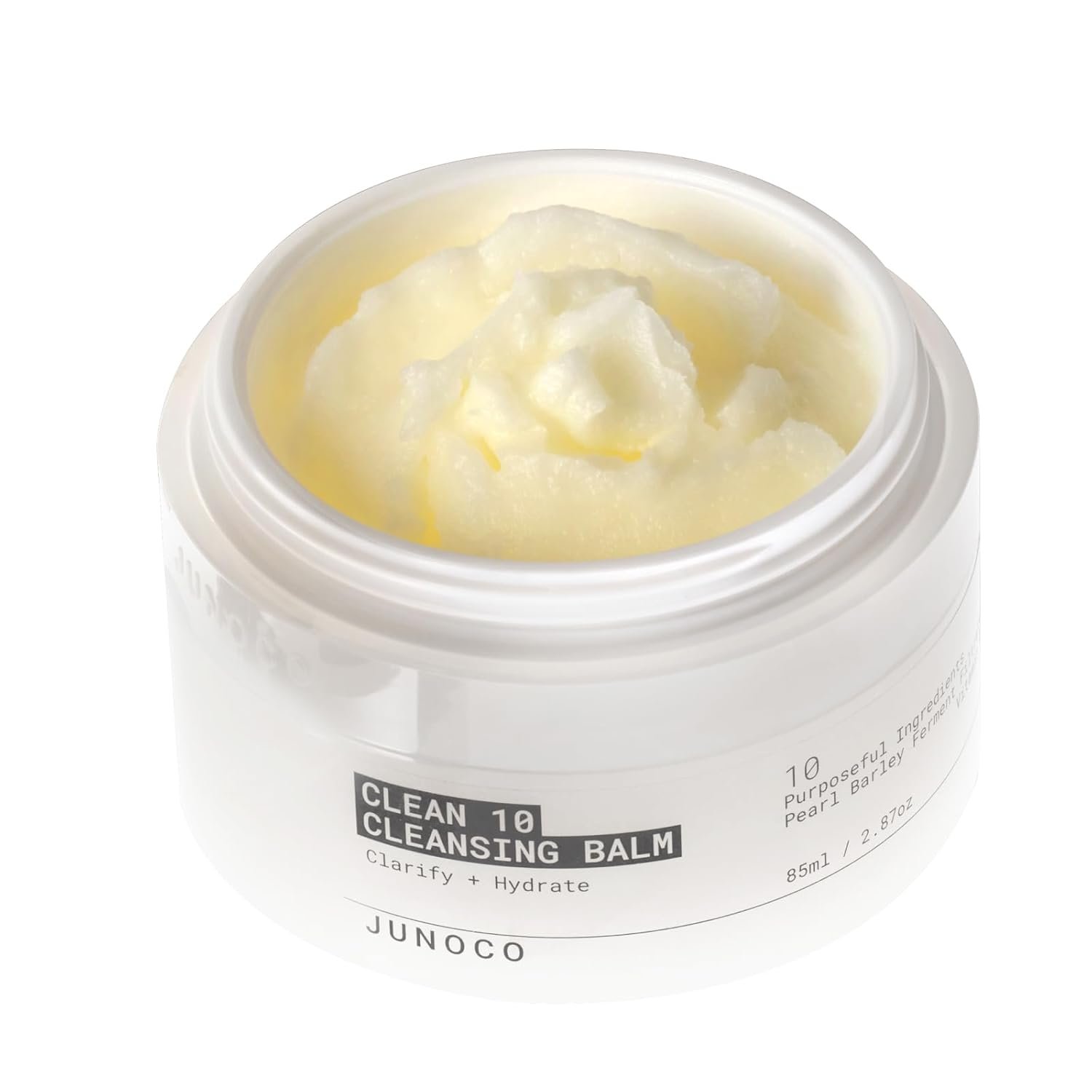 Open JunoSkin Clean 10 cleansing balm jar with white lid leaning back, shot on a cool gradient background.