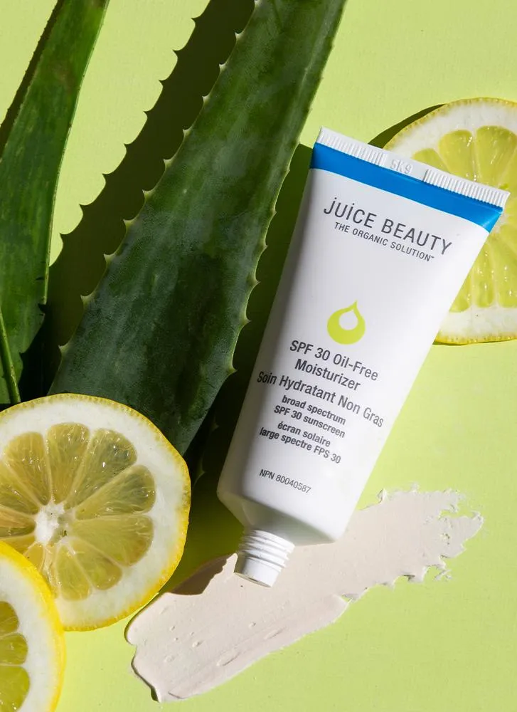 Aloe leaves and lemon frame Juice Beauty SPF 30 Oil-Free Moisturizer tube.