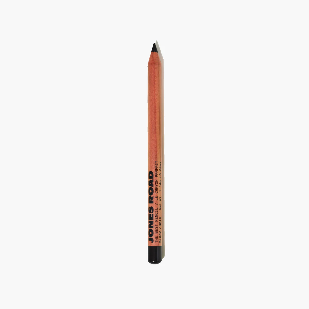 Jones Road “The Best Pencil” eyeliner in classic black, sharpened wooden pencil standing upright against a white background.