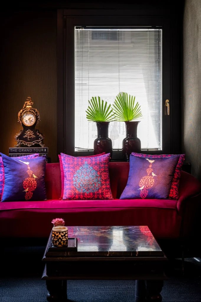 Rich velvet lounge at Ca Maria Adele Venice with jewel-toned cushions and dramatic interiors