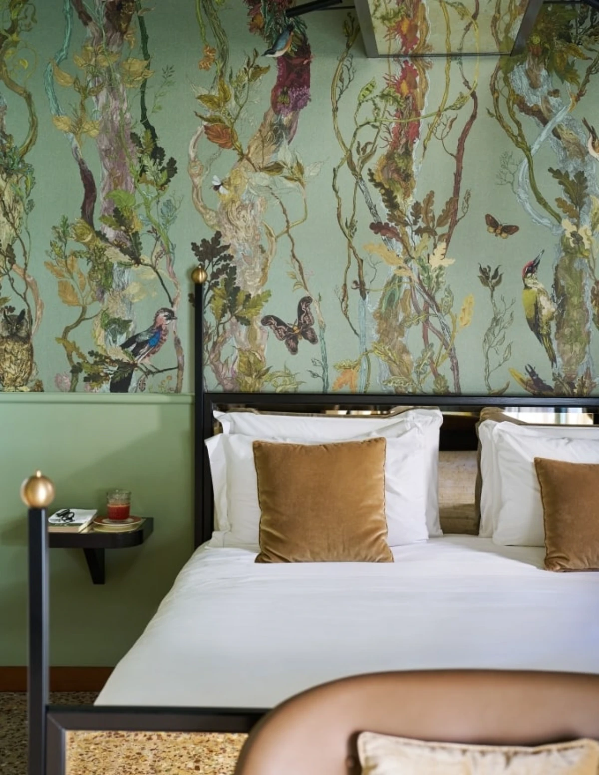 Botanical-inspired suite at Madama Garden Retreat Venice with illustrated wallpaper and velvet accents
