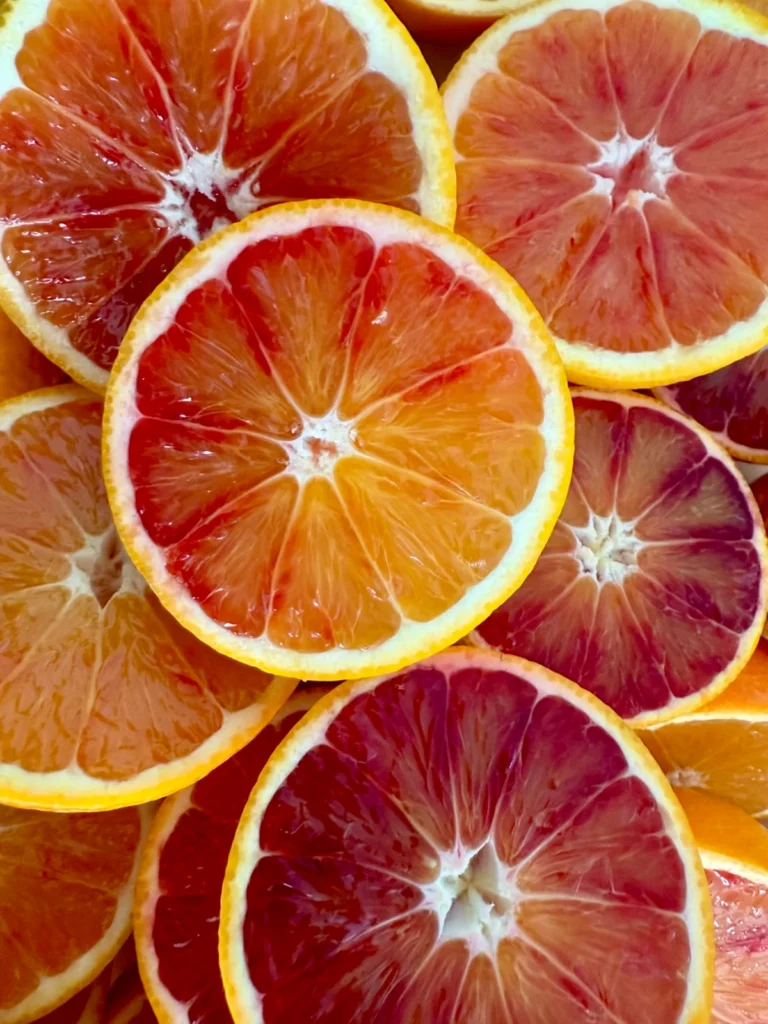 Close-up of sliced pink grapefruits showing vibrant citrus flesh and fresh juicy texture
