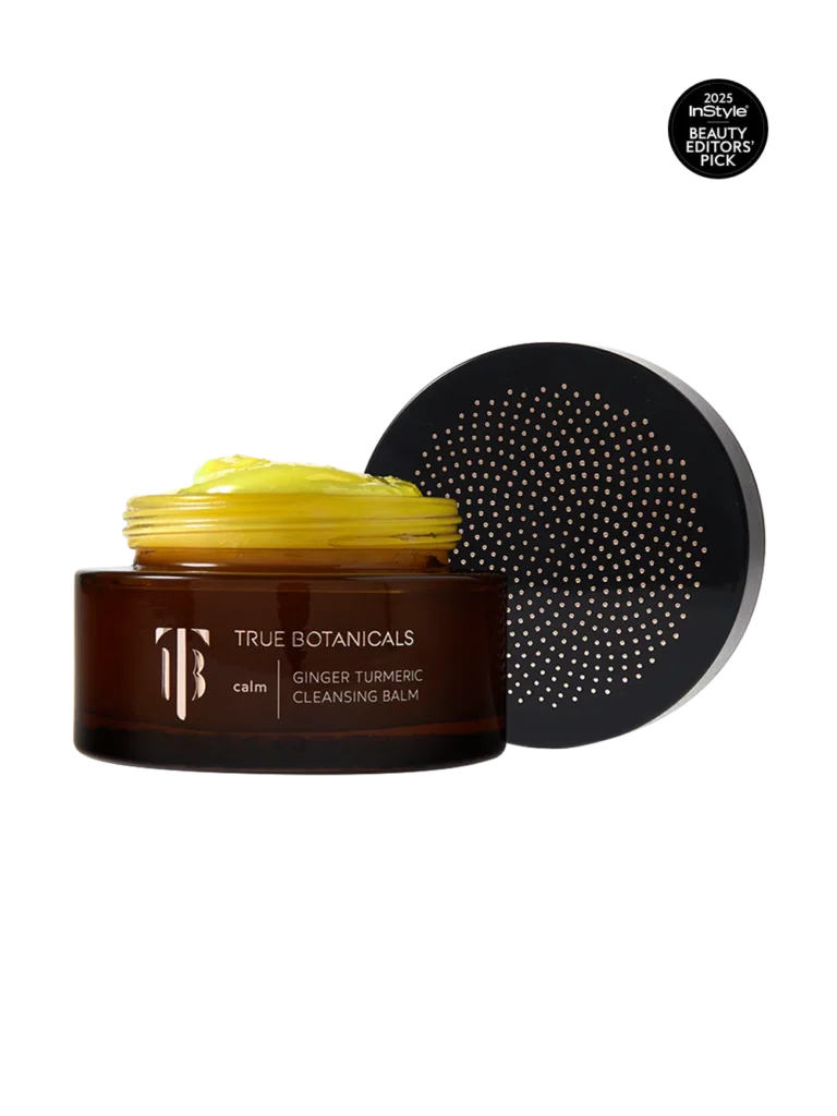 True Botanicals Ginger Turmeric Cleansing Balm in amber jar with golden cleansing balm texture and lid beside it