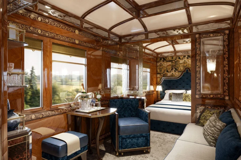 The Venice Suite with a marquetry-paneled interior, blue velvet seating, and champagne on ice.